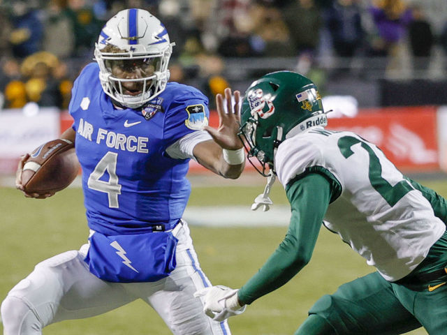 FORT WORTH, TX - DECEMBER 22: Air Force Falcons quarterback Haaziq Daniels (4) tries to outrun Baylor Bears cornerback Tevin Williams III (27) during the Lockheed Martin Armed Forces Bowl between the Baylor Bears and the Air Force Falcons on December 22, 2022 at Amon G. Carter Stadium in Fort Worth, TX.