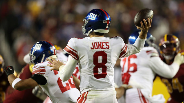 LANDOVER, MARYLAND - DECEMBER 18: Daniel Jones #8 of the New York Giants looks to pass the ball during the third quarter against the Washington Commanders at FedExField on December 18, 2022 in Landover, Maryland.