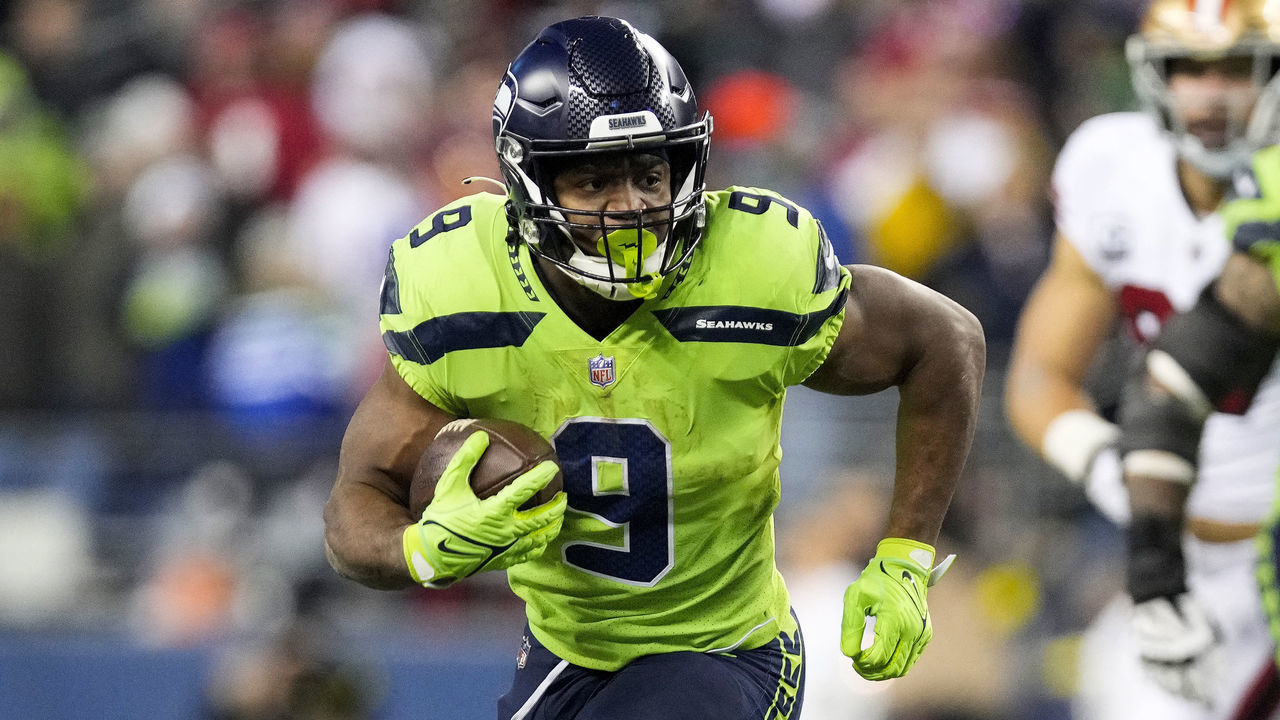 SEATTLE, WASHINGTON - DECEMBER 15: Kenneth Walker III #9 of the Seattle Seahawks carries the ball against the San Francisco 49ers during the fourth quarter of the game at Lumen Field on December 15, 2022 in Seattle, Washington.