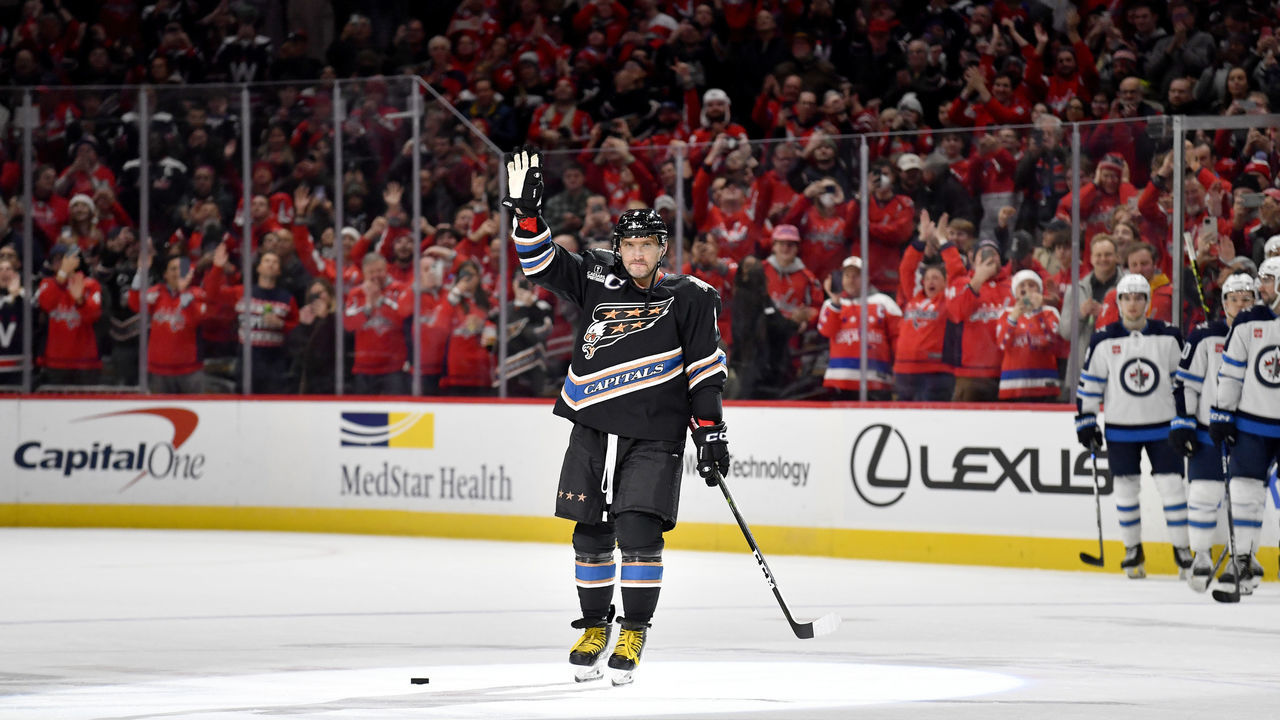WASHINGTON, DC - DECEMBER 23: Capitals left wing Alexander Alex Ovechkin (8) waves to the crowd after scoring his 802nd career NHL goal to pass Gordie Howe and move into 2nd place all-time for NHL career goals during the Winnipeg Jets versus Washington Capitals National Hockey League game on December 23, 2022 at Capital One Arena in Washington, D.C..