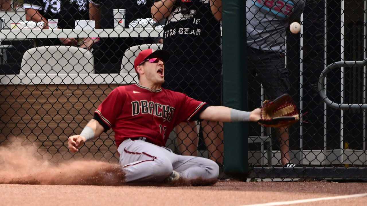 CHICAGO, ILLINOIS - AUGUST 28: Daulton Varsho #12 of the Arizona Diamondbacks comes up short on a fly ball off the bat of Andrew Vaughn of the Chicago White Sox that went for a double in the sixth inning at Guaranteed Rate Field on August 28, 2022 in Chicago, Illinois.