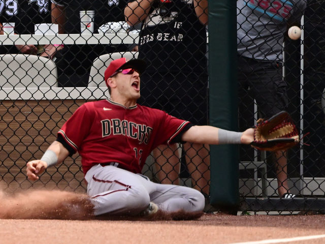 CHICAGO, ILLINOIS - AUGUST 28: Daulton Varsho #12 of the Arizona Diamondbacks comes up short on a fly ball off the bat of Andrew Vaughn of the Chicago White Sox that went for a double in the sixth inning at Guaranteed Rate Field on August 28, 2022 in Chicago, Illinois.