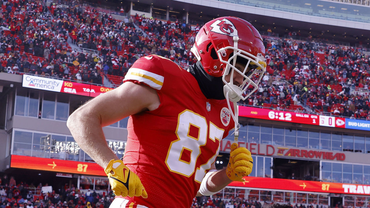 KANSAS CITY, MISSOURI - DECEMBER 24: Travis Kelce #87 of the Kansas City Chiefs runs onto the field during pregame against the Seattle Seahawks at Arrowhead Stadium on December 24, 2022 in Kansas City, Missouri.