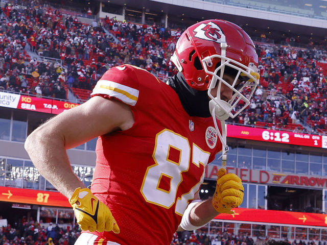 KANSAS CITY, MISSOURI - DECEMBER 24: Travis Kelce #87 of the Kansas City Chiefs runs onto the field during pregame against the Seattle Seahawks at Arrowhead Stadium on December 24, 2022 in Kansas City, Missouri.