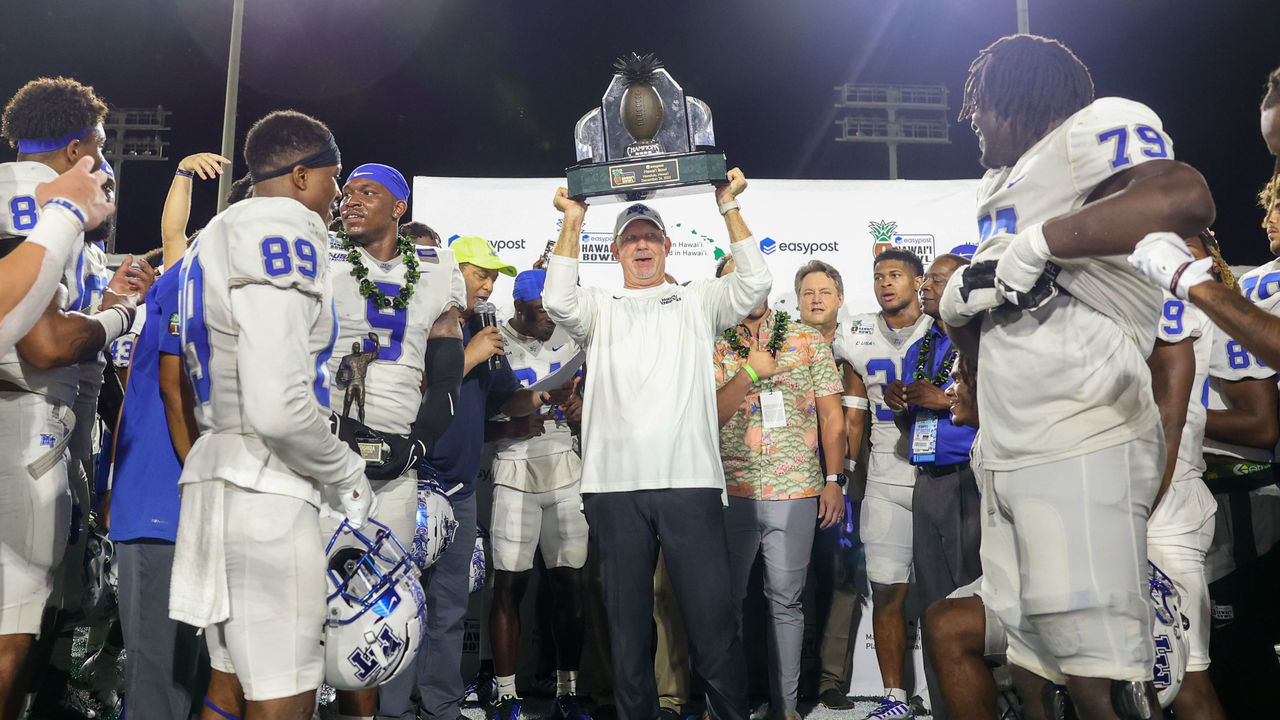 HONOLULU, HI - DECEMBER 24: Head coach Rick Stockstill of the Middle Tennessee Blue Raiders holds up the Hawaii Bowl Trophy after beating the San Diego State Aztecs in the EasyPost Hawaii Bowl at the Clarence T.C. Ching Athletics Complex on December 24, 2022 in Honolulu, Hawaii.