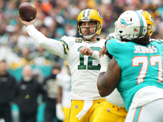 MIAMI GARDENS, FLORIDA - DECEMBER 25: Aaron Rodgers #12 of the Green Bay Packers throws a pass during the first quarter of the game against the Miami Dolphins at Hard Rock Stadium on December 25, 2022 in Miami Gardens, Florida.