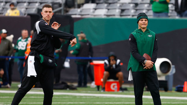 EAST RUTHERFORD, NJ - NOVEMBER 27: New York Jets quarterback Zach Wilson (2) watches New York Jets quarterback Mike White (5) warm up prior to the National Football League game between the New York Jets and the Chicago Bears on November 27, 2022 at MetLife Stadium in East Rutherford, New Jersey.