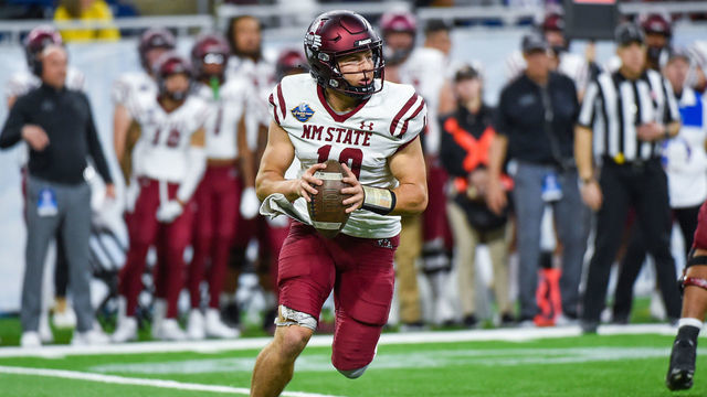 DETROIT, MICHIGAN - DECEMBER 26: Diego Pavia #10 of the New Mexico State Aggies scrambles with the ball during the first half of the Quick Lane Bowl against the Bowling Green Falcons at Ford Field on December 26, 2022 in Detroit, Michigan.
