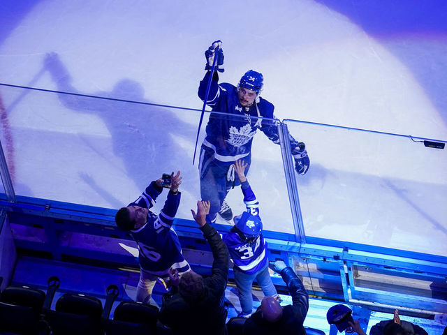 TORONTO, ON - DECEMBER 20: Auston Matthews #34 of the Toronto Maple Leafs gives a stick to a fan after receiving a star of the game after defeating the Tampa Bay Lightning at the Scotiabank Arena on December 20, 2022 in Toronto, Ontario, Canada.