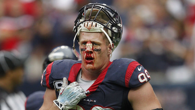 HOUSTON, TX - SEPTEMBER 29: J.J. Watt #99 of the Houston Texans walks off the field in the fourth quarter with a bloody face after reaggravating a cut on the bridge of his nose against the Seattle Seahawks at Reliant Stadium on September 29, 2013 in Houston, Texas.