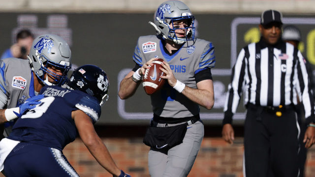 DALLAS, TX - DECEMBER 27: Seth Henigan #5 of the Memphis Tigers looks to throw against the Utah State Aggies in the first half of the SERVPRO First Responder Bowl at Gerald J. Ford Stadium on December 27, 2022 in Dallas, Texas.