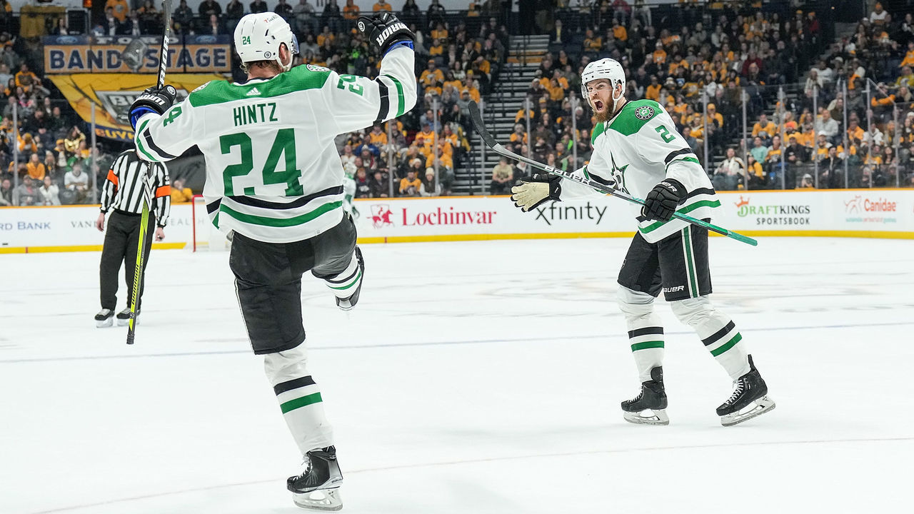 NASHVILLE, TENNESSEE - DECEMBER 27: Roope Hintz #24 celebrates his goal with Jani Hakanpää #2 of the Dallas Stars against the Nashville Predators during an NHL game at Bridgestone Arena on December 27, 2022 in Nashville, Tennessee.