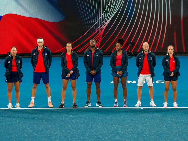 SYDNEY, AUSTRALIA - DECEMBER 29: Team USA (l-r) Jessica Pegula, Taylor Fritz, Madison Keys, Frances Tiafoe sing national anthem ahead of the Group C match between Taylor Fritz of USA and Jiri Lehecka of the Czech Republic during day one of the 2023 United Cup at Ken Rosewall Arena on December 29, 2022 in Sydney, Australia.