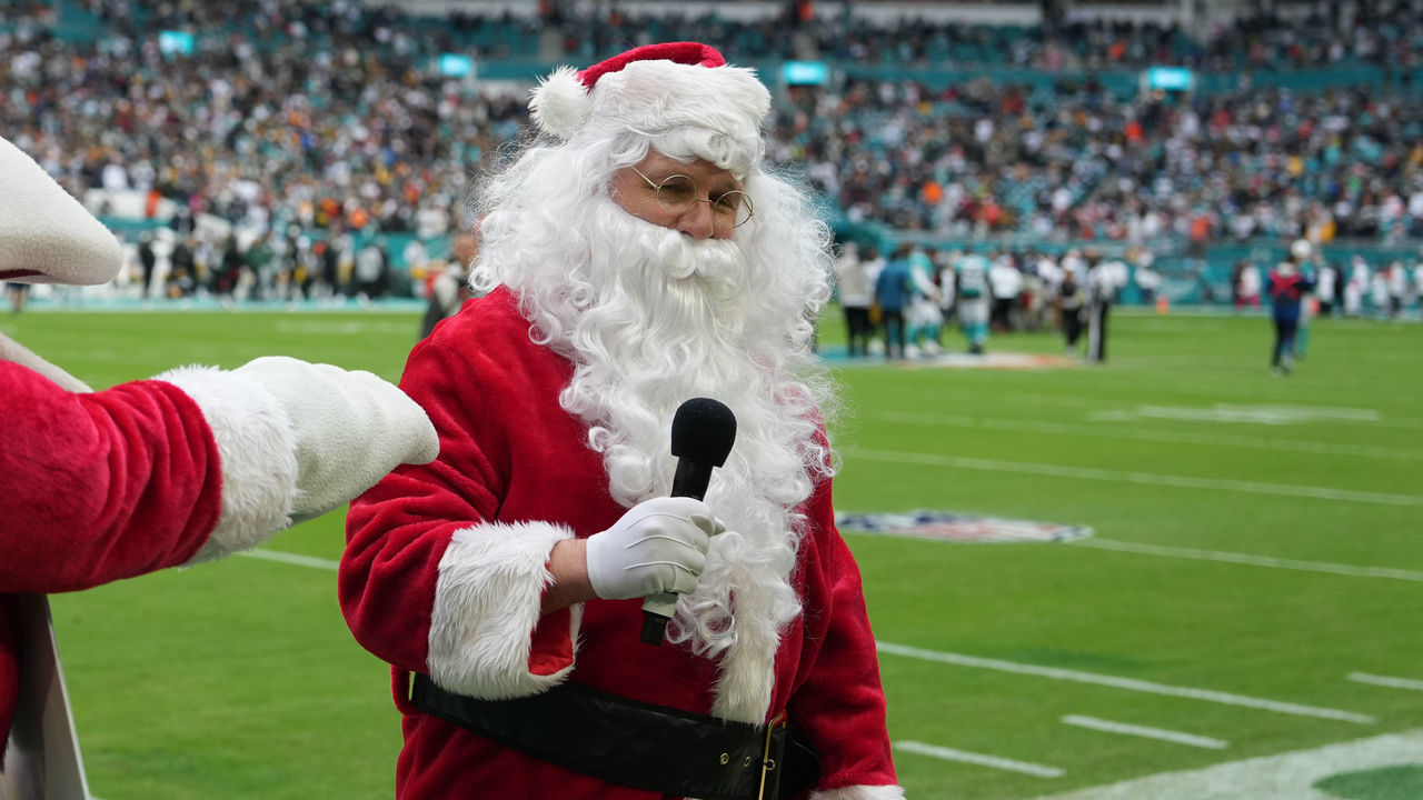 MIAMI GARDENS, FL - DECEMBER 25: Santa Claus gets ready to speak to fans before the game between the Green Bay Packers and the Miami Dolphins on Sunday, December 25, 2022 at Hard Rock Stadium, Miami Gardens, Fla.