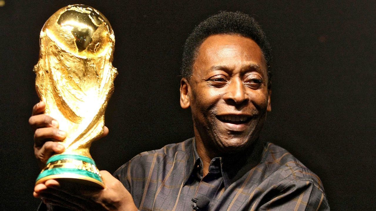 Brazilian football star Pele displays the FIFA World Cup during its presentation in Rio de Janeiro, Brazil on February 6, 2010. The cup is being exhibited in numerous countries while on a tour before reaching South Africa for the FIFA World Cup tournament that will be held next June. AFP PHOTO/GABRIEL LOPES