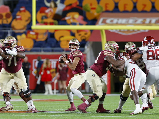 ORLANDO, FL - DECEMBER 29: Florida State Seminoles quarterback Jordan Travis (13) throws a pass during the Cheez-It Bowl between the Florida State Seminoles and Oklahoma Sooners on December 29, 2022 at Camping World Stadium in Orlando, Fl.