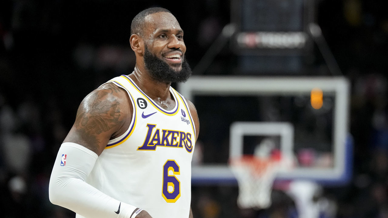 DETROIT, MICHIGAN - DECEMBER 11: LeBron James #6 of the Los Angeles Lakers looks on and smiles against the Detroit Pistons at Little Caesars Arena on December 11, 2022 in Detroit, Michigan.