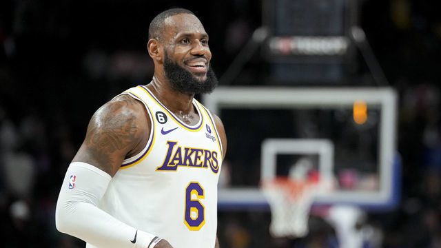 DETROIT, MICHIGAN - DECEMBER 11: LeBron James #6 of the Los Angeles Lakers looks on and smiles against the Detroit Pistons at Little Caesars Arena on December 11, 2022 in Detroit, Michigan.