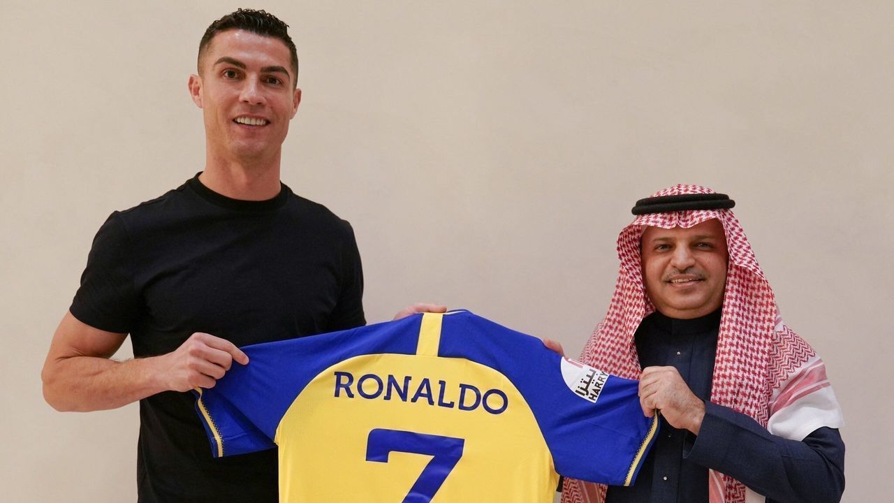 RIYADH, SAUDI ARABIA - DECEMBER 30: (----EDITORIAL USE ONLY â MANDATORY CREDIT - "ALL NASSR FOOTBALL CLUB / HANDOUT" - NO MARKETING NO ADVERTISING CAMPAIGNS - DISTRIBUTED AS A SERVICE TO CLIENTS----) Portuguese football star Cristiano Ronaldo poses for a photo with the jersey after signing with Saudi Arabia's Al-Nassr Football Club in Riyadh, Saudi Arabia on December 30, 2022.