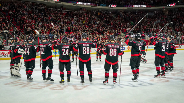 RALEIGH, NORTH CAROLINA - DECEMBER 30: The Carolina Hurricanes celebrate with the Storm Surge after defeating the Florida Panthers at PNC Arena on December 30, 2022 in Raleigh, North Carolina.