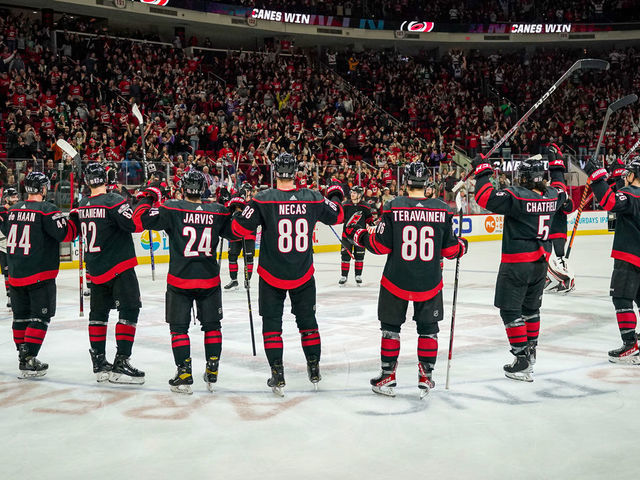 RALEIGH, NORTH CAROLINA - DECEMBER 30: The Carolina Hurricanes celebrate with the Storm Surge after defeating the Florida Panthers at PNC Arena on December 30, 2022 in Raleigh, North Carolina.
