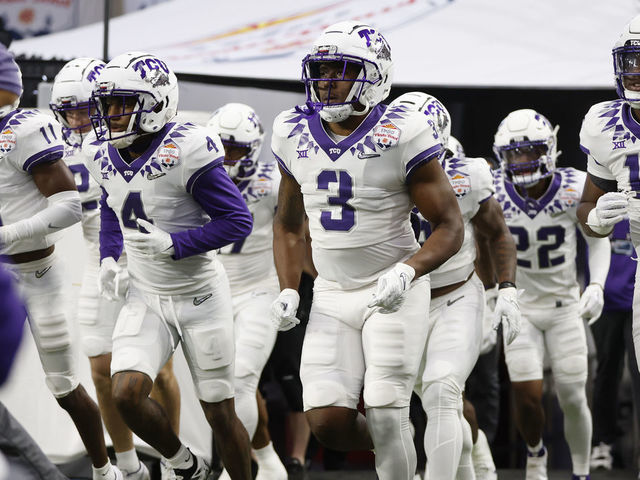 GLENDALE, ARIZONA - DECEMBER 31: The TCU Horned Frogs take the field prior to the game against the Michigan Wolverines in the Vrbo Fiesta Bowl at State Farm Stadium on December 31, 2022 in Glendale, Arizona.