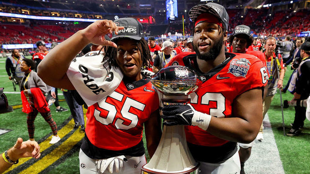 ATLANTA, GEORGIA - DECEMBER 31: The Georgia Bulldogs celebrate after defeating the Ohio State Buckeyes in the Chick-fil-A Peach Bowl at Mercedes-Benz Stadium on December 31, 2022 in Atlanta, Georgia.