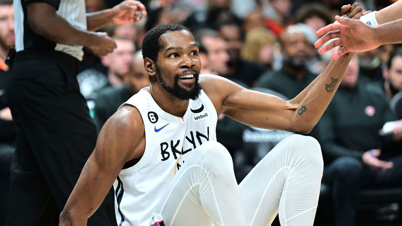 ATLANTA, GA - DECEMBER 28: Kevin Durant #7 of the Brooklyn Nets is helped up during the game against the Atlanta Hawks on December 28, 2022 at State Farm Arena in Atlanta, Georgia. NOTE TO USER: User expressly acknowledges and agrees that, by downloading and/or using this Photograph, user is consenting to the terms and conditions of the Getty Images License Agreement. Mandatory Copyright Notice: Copyright 2022 NBAE