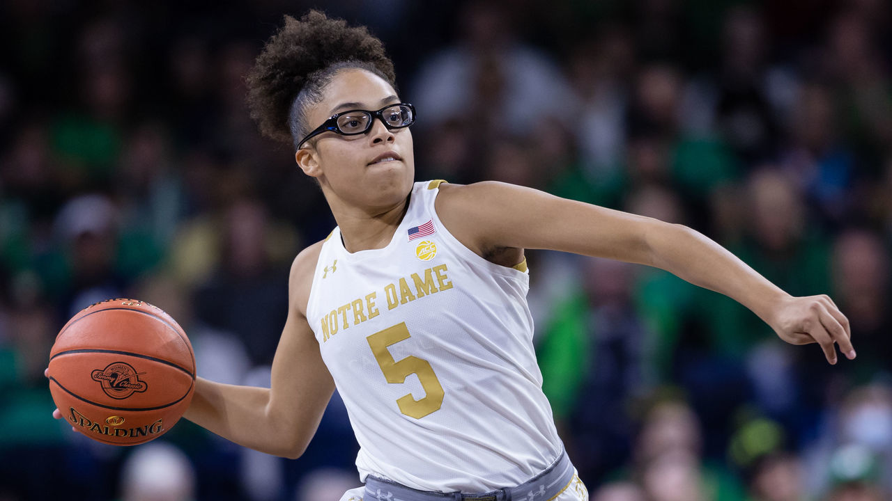 SOUTH BEND, IN - DECEMBER 04: Olivia Miles #5 of the Notre Dame Fighting Irish brings the ball up court during the game against the UConn Huskies at Joyce Center on December 4, 2022 in South Bend, Indiana.