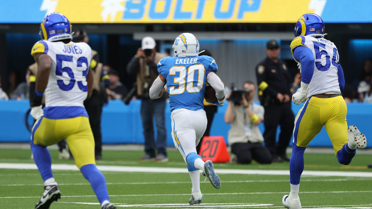 INGLEWOOD, CALIFORNIA - JANUARY 01: Austin Ekeler #30 of the Los Angeles Chargers runs the ball for a touchdown during the second quarter in the game against the Los Angeles Rams at SoFi Stadium on January 01, 2023 in Inglewood, California.