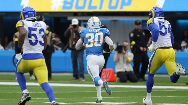INGLEWOOD, CALIFORNIA - JANUARY 01: Austin Ekeler #30 of the Los Angeles Chargers runs the ball for a touchdown during the second quarter in the game against the Los Angeles Rams at SoFi Stadium on January 01, 2023 in Inglewood, California.