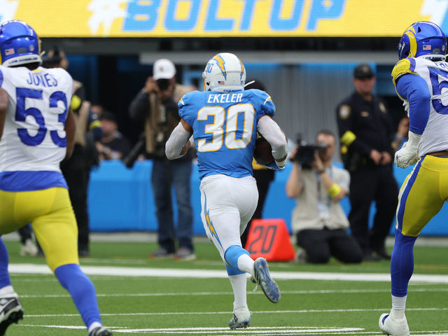 INGLEWOOD, CALIFORNIA - JANUARY 01: Austin Ekeler #30 of the Los Angeles Chargers runs the ball for a touchdown during the second quarter in the game against the Los Angeles Rams at SoFi Stadium on January 01, 2023 in Inglewood, California.