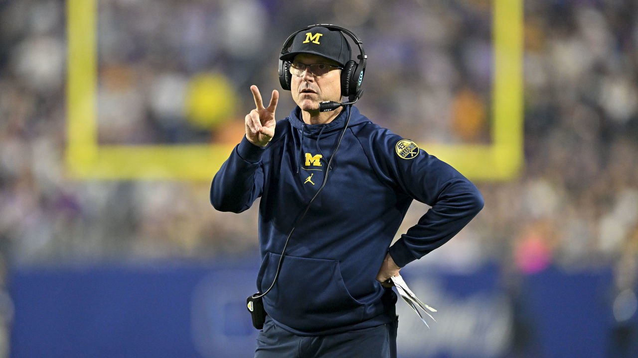 GLENDALE, ARIZONA - DECEMBER 31: Head coach Jim Harbaugh of the Michigan Wolverines calls for a two point conversion during the third quarter of the College Football Playoff Semifinal Fiesta Bowl football game against the TCU Horned Frogs at State Farm Stadium on December 31, 2022 in Glendale, Arizona. The TCU Horned Frogs won 51-45.
