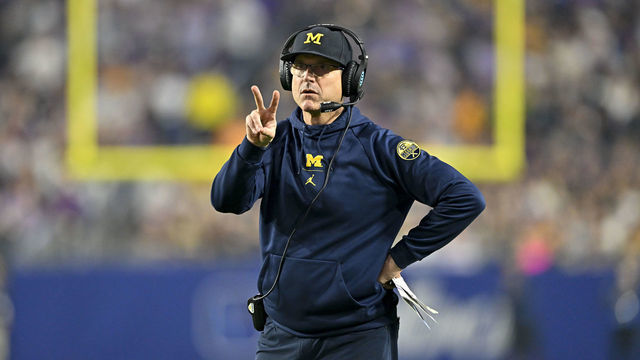 GLENDALE, ARIZONA - DECEMBER 31: Head coach Jim Harbaugh of the Michigan Wolverines calls for a two point conversion during the third quarter of the College Football Playoff Semifinal Fiesta Bowl football game against the TCU Horned Frogs at State Farm Stadium on December 31, 2022 in Glendale, Arizona. The TCU Horned Frogs won 51-45.