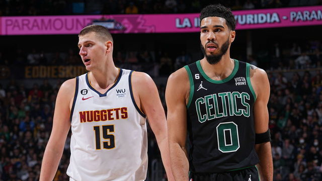 DENVER, CO - JANUARY 1: Opponents Nikola Jokic #15 of the Denver Nuggets and Jayson Tatum #0 of the Boston Celtics stand on the court during the game on January 1, 2023 at the Ball Arena in Denver, Colorado. NOTE TO USER: User expressly acknowledges and agrees that, by downloading and/or using this Photograph, user is consenting to the terms and conditions of the Getty Images License Agreement. Mandatory Copyright Notice: Copyright 2022 NBAE