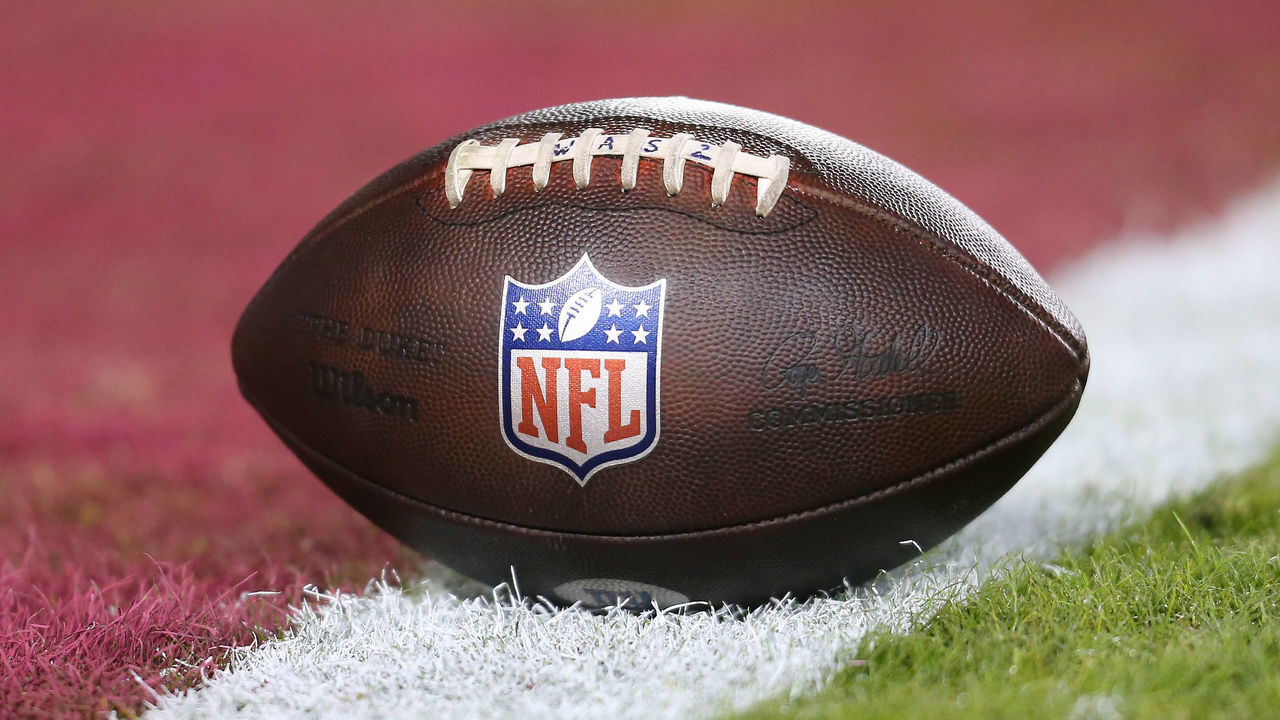 LANDOVER, MD - DECEMBER 18: .Football woth NFL logo resting on the field prior to the New York Giants game versus the Washington Commanders on December 18, 2022, at FedEx Field in Landover, MD.