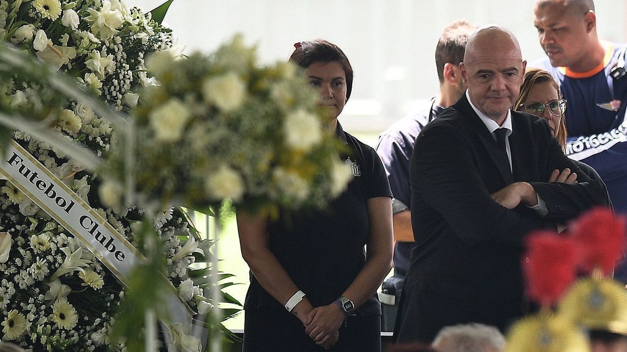 FIFA President Gianni Infantino (R) attends the wake of Brazilian football legend Pele at the Urbano Caldeira stadium in Santos, Sao Paulo, Brazil on January 2, 2023. - Brazilians bid a final farewell this week to football giant Pele, starting Monday with a 24-hour public wake at the stadium of his long-time team, Santos.