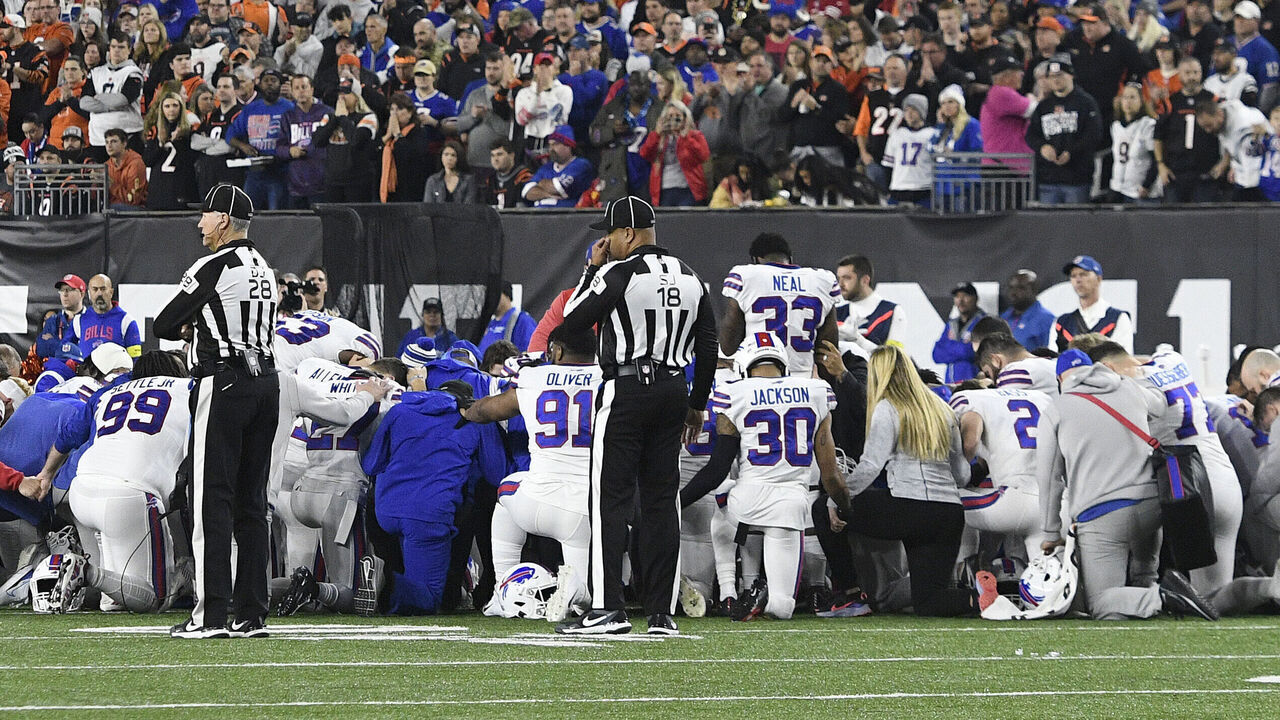 CINCINNATI, OH - JANUARY 02: The Buffalo Bills circle up as play is suspended after Buffalo Bills safety Damar Hamlin (3) collapsed during the NFL football game between the Buffalo Bills and the Cincinnati Bengals on January 2, 2023, at Paycor Stadium in Cincinnati, Ohio.