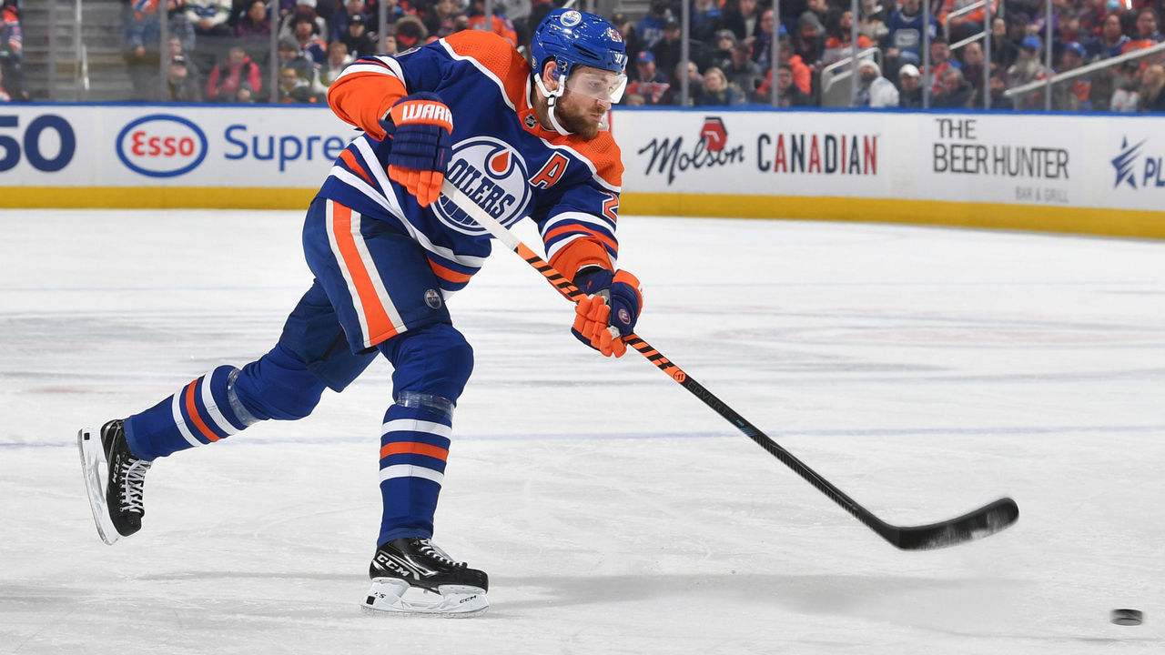EDMONTON, CANADA - DECEMBER 23: Leon Draisaitl #29 of the Edmonton Oilers takes a shot during the game against the Vancouver Canucks on December 23, 2022 at Rogers Place in Edmonton, Alberta, Canada.