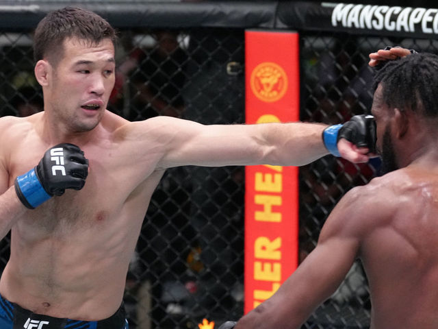 LAS VEGAS, NEVADA - JUNE 25: (L-R) Shavkat Rakhmonov of Uzbekistan punches Neil Magny in a welterweight fight during the UFC Fight Night event at UFC APEX on June 25, 2022 in Las Vegas, Nevada.