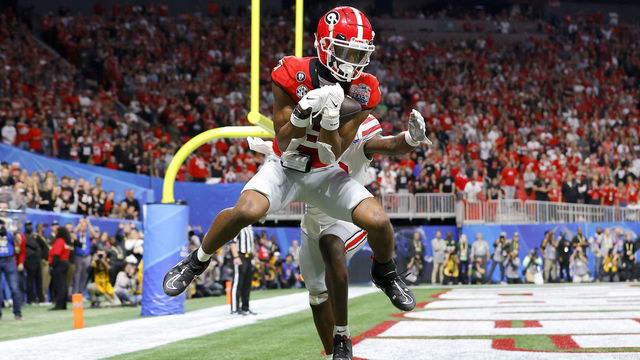 ATLANTA, GEORGIA - DECEMBER 31: Adonai Mitchell #5 of the Georgia Bulldogs catches a touchdown pass during the fourth quarter against the Ohio State Buckeyes in the Chick-fil-A Peach Bowl at Mercedes-Benz Stadium on December 31, 2022 in Atlanta, Georgia.