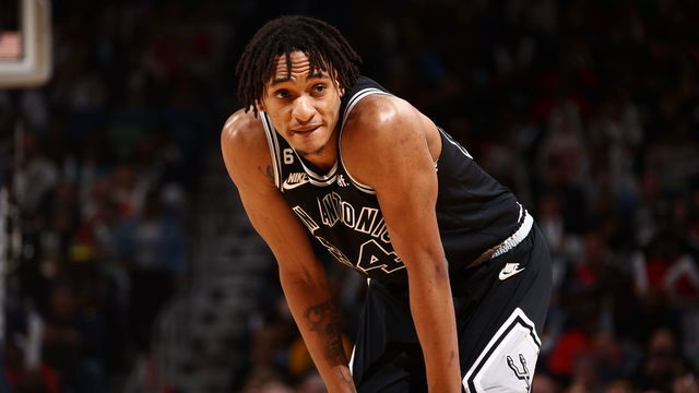 NEW ORLEANS, LA - DECEMBER 22: Devin Vassell #24 of the San Antonio Spurs looks on during the game against the New Orleans Pelicans on December 22, 2022 at the Smoothie King Center in New Orleans, Louisiana. Mandatory Copyright Notice: Copyright 2022 NBAE
