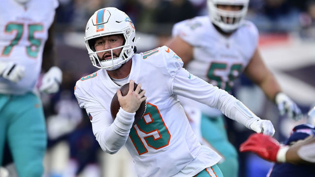 FOXBOROUGH, MASSACHUSETTS - JANUARY 01: Skylar Thompson #19 of the Miami Dolphins carries the ball against the New England Patriots at Gillette Stadium on January 01, 2023 in Foxborough, Massachusetts.