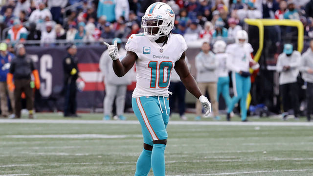 FOXBOROUGH, MA - JANUARY 01: Miami Dolphins wide receiver Tyreek Hill (10) checks with the down judge during a game between the New England Patriots and the Miami Dolphins on January 1, 2023, at Gillette Stadium in Foxboro, Massachusetts.