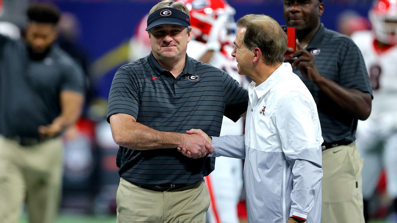 ATLANTA, GEORGIA - DECEMBER 04: Head Coach Nick Saban of the Alabama Crimson Tide talks with Head Coach Kirby Smart of the Georgia Bulldogs before the SEC Championship game at Mercedes-Benz Stadium on December 04, 2021 in Atlanta, Georgia.