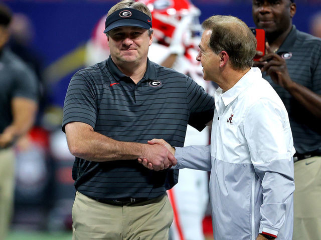 ATLANTA, GEORGIA - DECEMBER 04: Head Coach Nick Saban of the Alabama Crimson Tide talks with Head Coach Kirby Smart of the Georgia Bulldogs before the SEC Championship game at Mercedes-Benz Stadium on December 04, 2021 in Atlanta, Georgia.