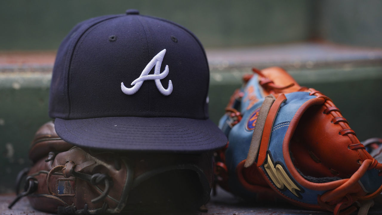 PHILADELPHIA, PA - JULY 26: A general view of gloves and an Atlanta Braves hat against the Philadelphia Phillies at Citizens Bank Park on July 26, 2022 in Philadelphia, Pennsylvania. The Braves defeated the Phillies 6-3.