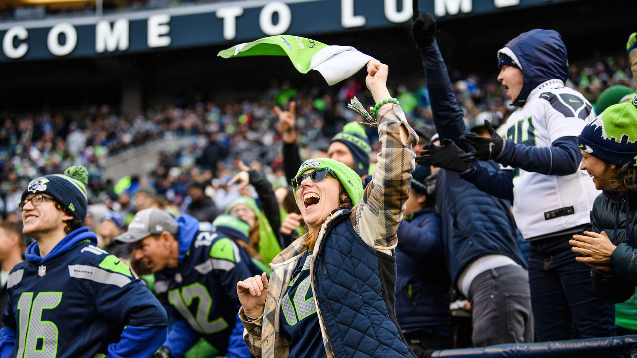SEATTLE, WASHINGTON - DECEMBER 11: A Seattle Seahawks fan cheers during the game against the Carolina Panthers at Lumen Field on December 11, 2022 in Seattle, Washington.