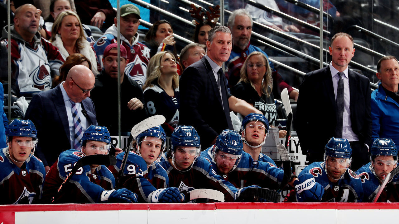 DENVER, COLORADO - DECEMBER 13: Head coach of the Colorado Avalanche, Jared Bednar, talks to his players on the bench during the third period against the Philadelphia Flyers at Ball Arena on December 13, 2022 in Denver, Colorado.