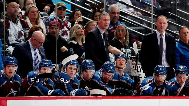 DENVER, COLORADO - DECEMBER 13: Head coach of the Colorado Avalanche, Jared Bednar, talks to his players on the bench during the third period against the Philadelphia Flyers at Ball Arena on December 13, 2022 in Denver, Colorado.